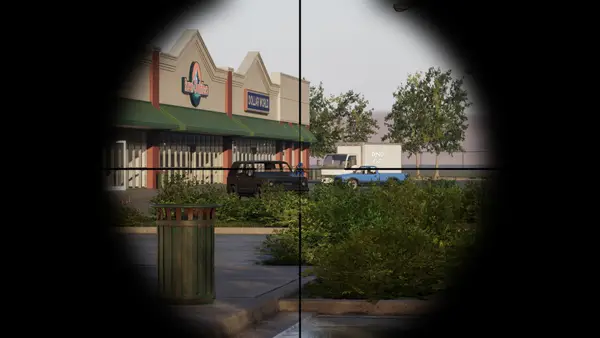 View through a rifle scope toward a row of shops in Hood Warfare 2 (official screenshot)